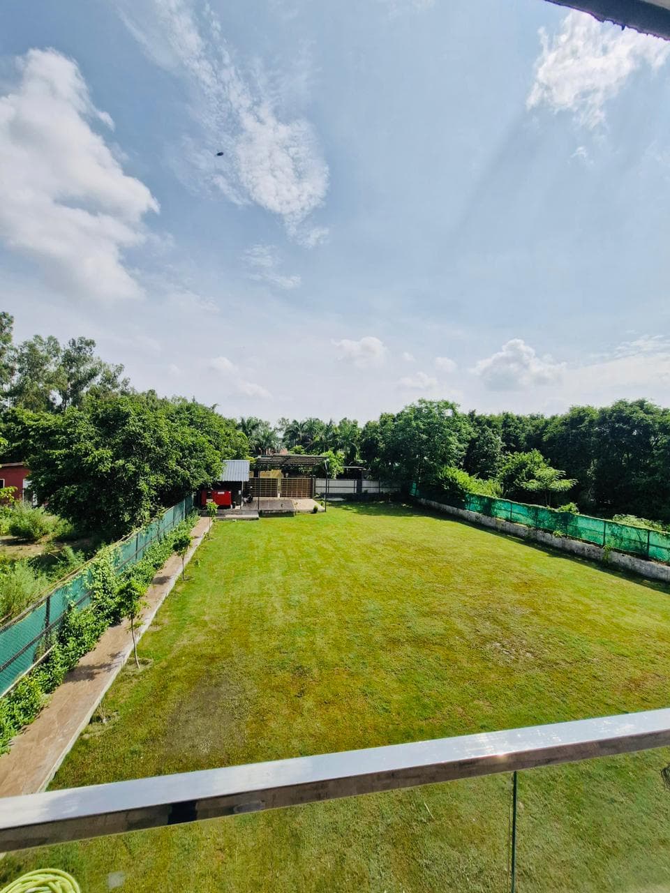 Vidhaan Farm House estate at golden hour